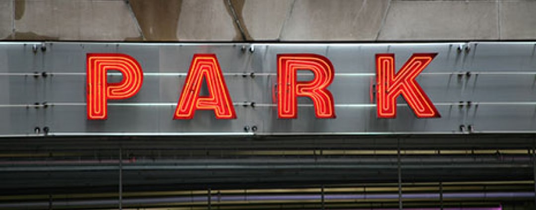 Red illuminated parking sign