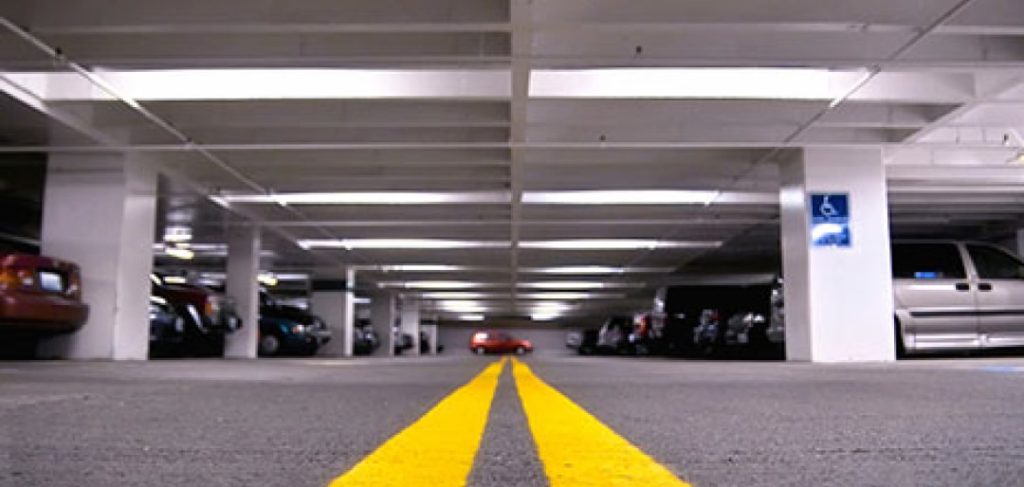 A ground-level perspective of the inside of a parking garage